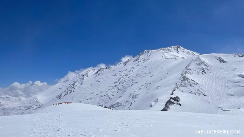 Lenin Peak and Camp 3 seen from Peak Razdelnaya